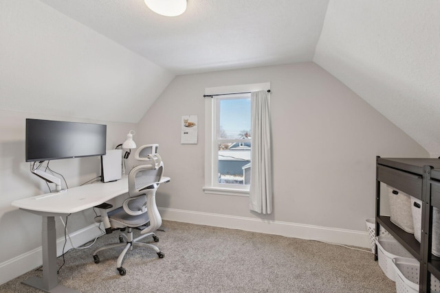 office space with vaulted ceiling and carpet floors