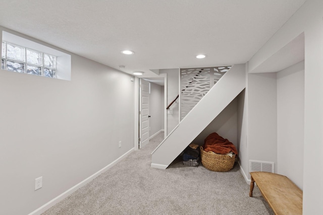 basement with carpet flooring