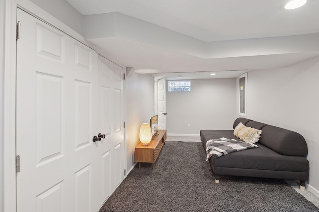 living room featuring dark colored carpet