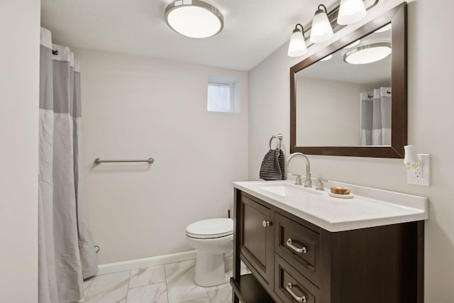 bathroom with toilet and vanity