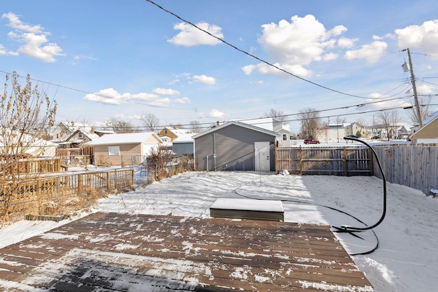 exterior space with a wooden deck and a storage shed