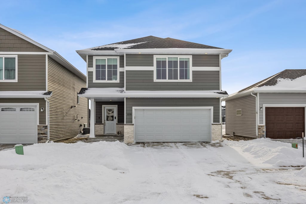 view of front of home with a garage