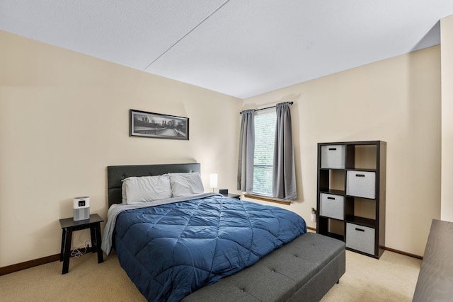 bedroom with light carpet