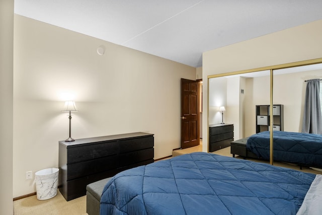 carpeted bedroom with a closet