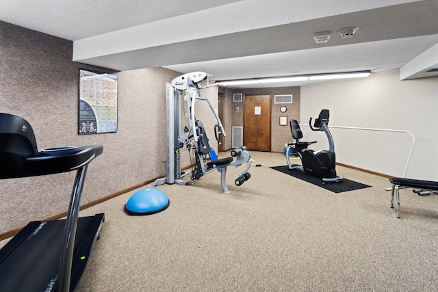 workout area with a textured ceiling