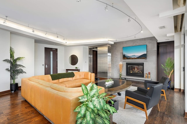 living room with dark hardwood / wood-style flooring