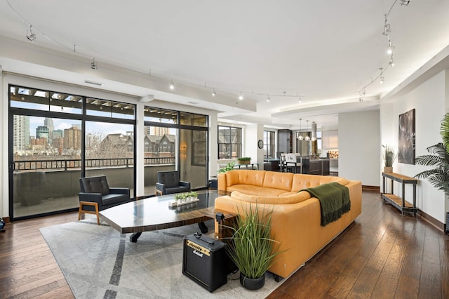 317 Groveland Ave Unit 700, Minneapolis, MN 55403 - living area featuring track lighting, plenty of natural light, and hardwood / wood-style floors