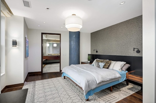 317 Groveland Ave Unit 700, Minneapolis, MN 55403 - bedroom with recessed lighting, wood finished floors, and ensuite bathroom