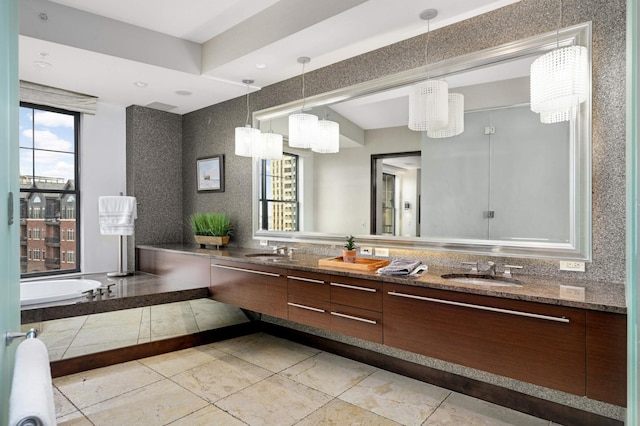 317 Groveland Ave Unit 700, Minneapolis, MN 55403 - bathroom featuring double vanity, a bathtub, and tile patterned floors