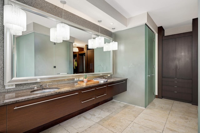 317 Groveland Ave Unit 700, Minneapolis, MN 55403 - bathroom with a chandelier and double vanity