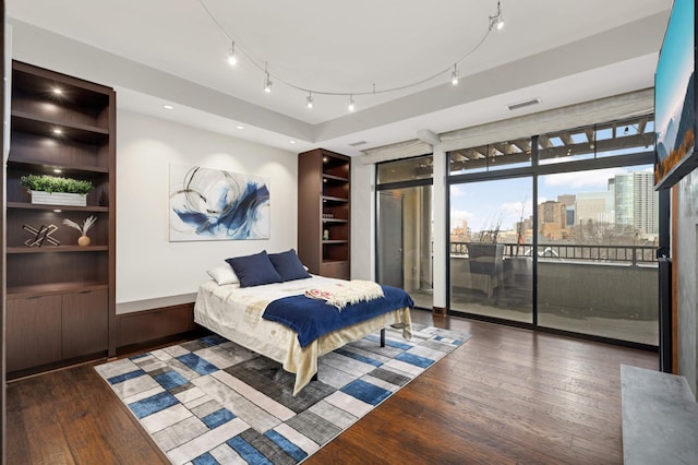 317 Groveland Ave Unit 700, Minneapolis, MN 55403 - bedroom featuring access to outside, wood finished floors, and a city view