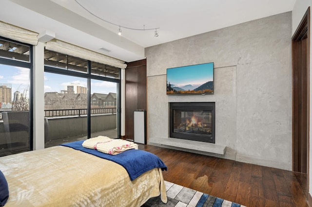 bedroom with dark hardwood / wood-style flooring