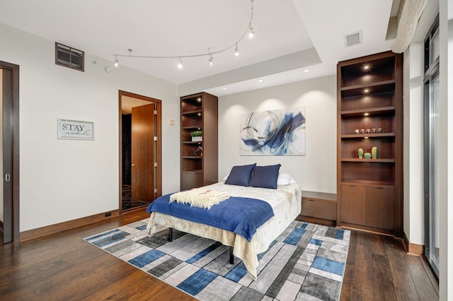 bedroom featuring dark hardwood / wood-style flooring