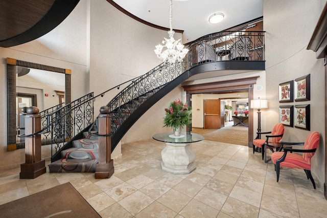 317 Groveland Ave Unit 700, Minneapolis, MN 55403 - entryway featuring a towering ceiling, stairs, and a chandelier