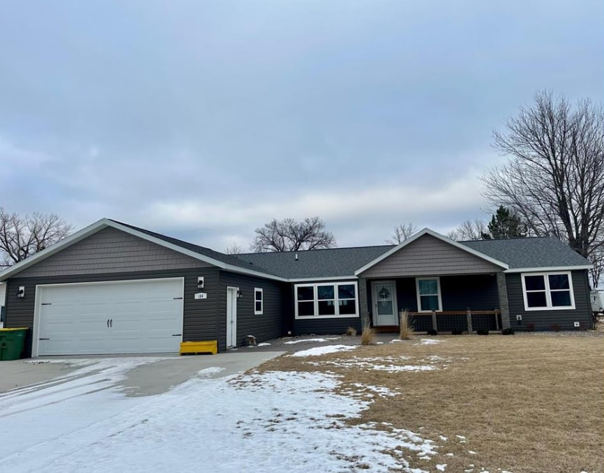 ranch-style house with an attached garage and driveway