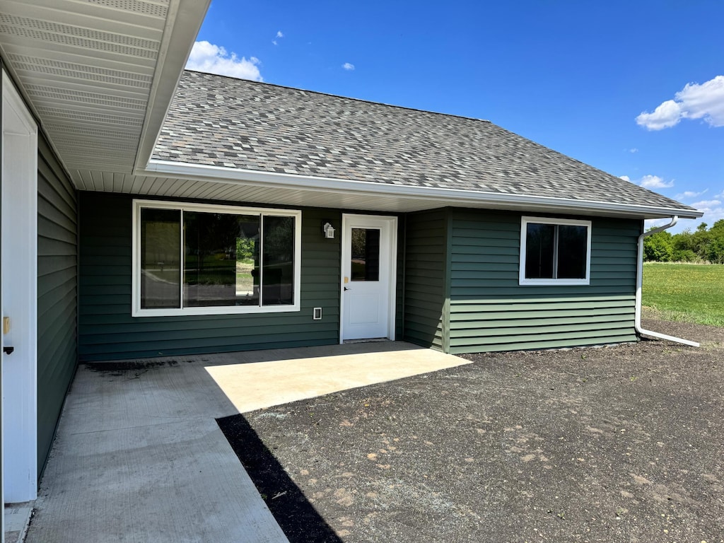 106 Front St, Tracy, MN 56175 - back of property featuring a shingled roof