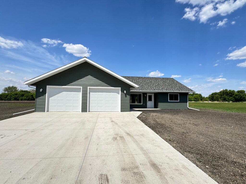106 Front St, Tracy, MN 56175 - single story home with concrete driveway and an attached garage