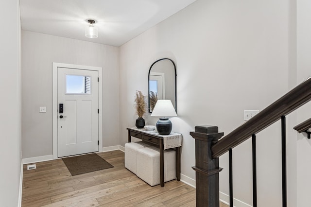 entrance foyer with light hardwood / wood-style flooring