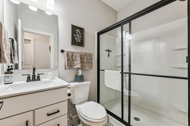 bathroom with vanity, toilet, and walk in shower