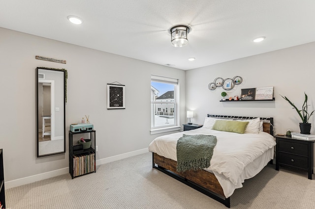 bedroom featuring light carpet