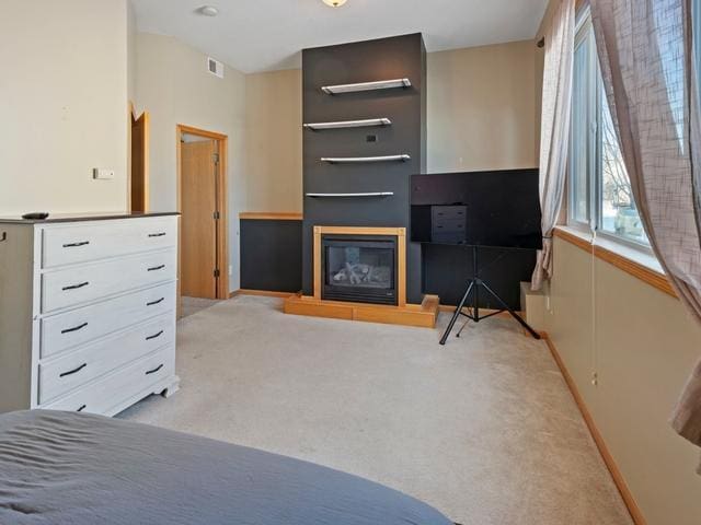 bedroom with light colored carpet