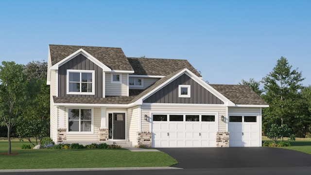 craftsman-style house with a garage and a front lawn