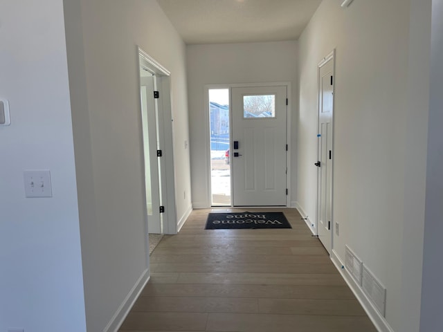 entryway featuring dark wood-type flooring