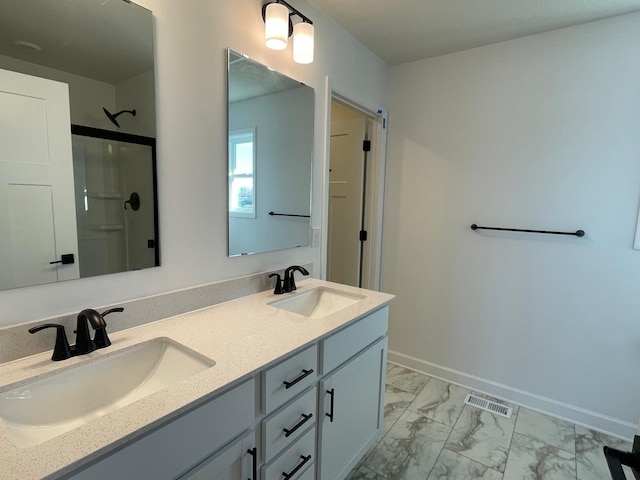 bathroom with walk in shower and vanity