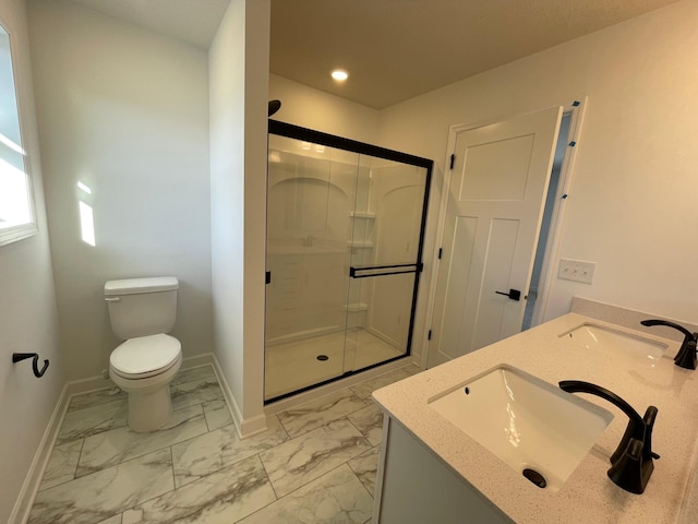 bathroom featuring vanity, an enclosed shower, and toilet