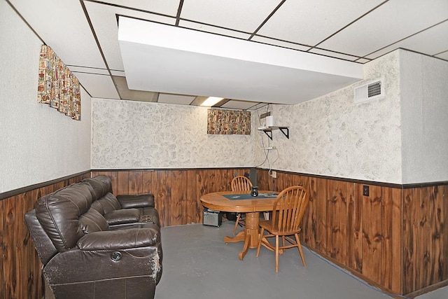 dining space featuring concrete flooring