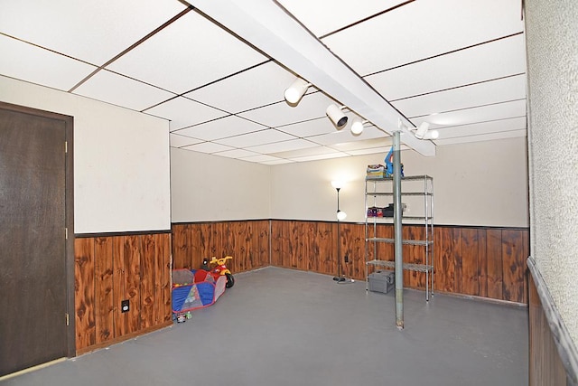 basement featuring a drop ceiling