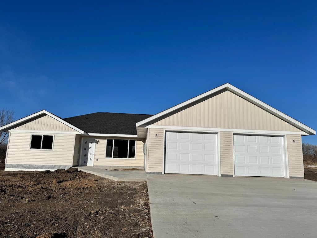 single story home featuring a garage