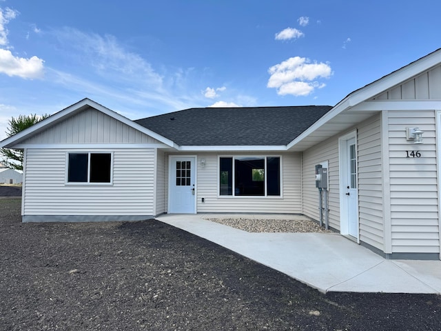 146 Front St, Tracy, MN 56175 - view of front facade featuring roof with shingles and a patio