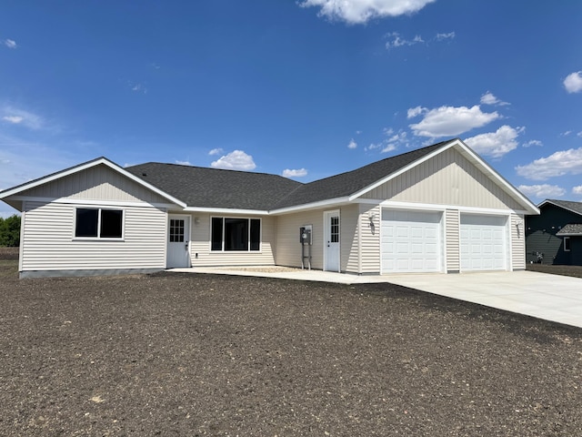 146 Front St, Tracy, MN 56175 - ranch-style house with an attached garage, driveway, and a shingled roof