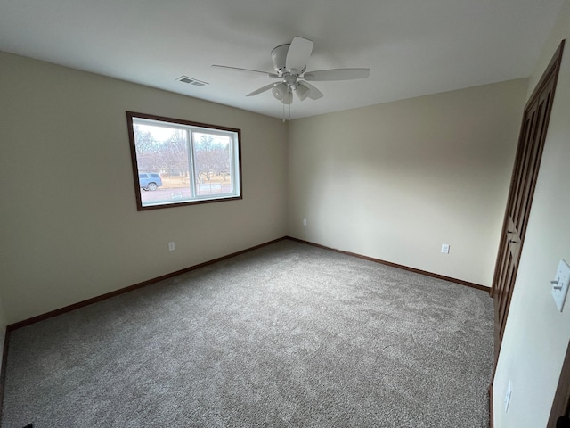 146 Front St, Tracy, MN 56175 - empty room featuring ceiling fan and carpet