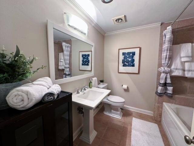 bathroom featuring a bathtub, sink, crown molding, tile patterned flooring, and toilet