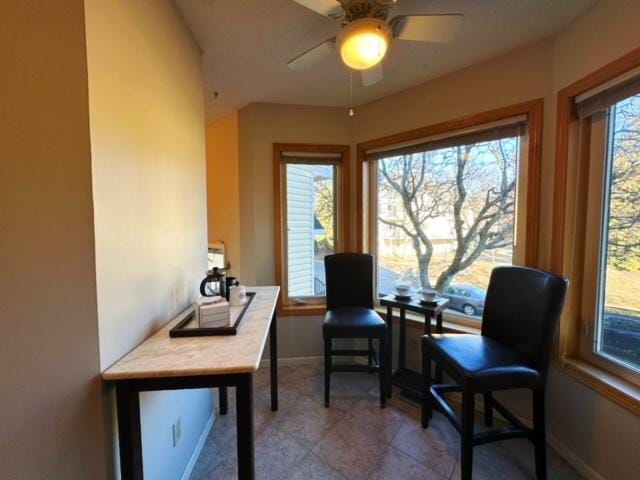 sitting room featuring ceiling fan and light tile patterned flooring