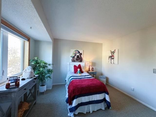 carpeted bedroom with a textured ceiling