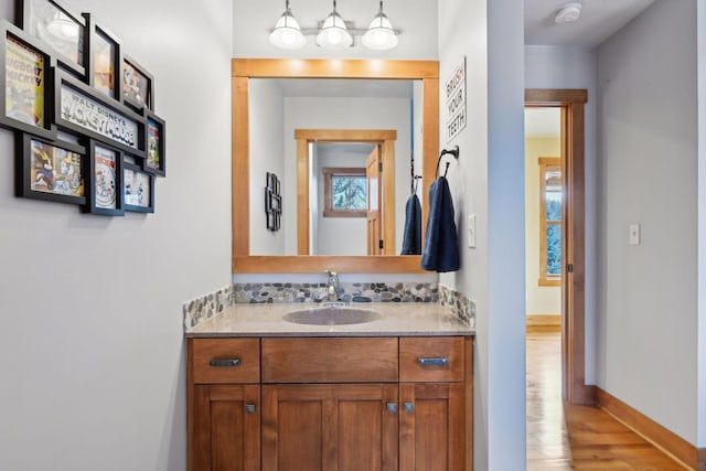 bathroom with hardwood / wood-style floors and vanity