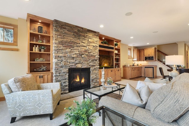 living room with built in shelves and a fireplace