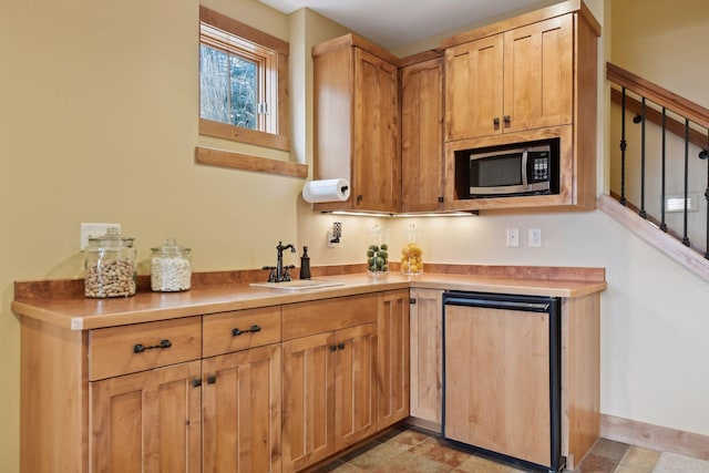 kitchen with sink and fridge