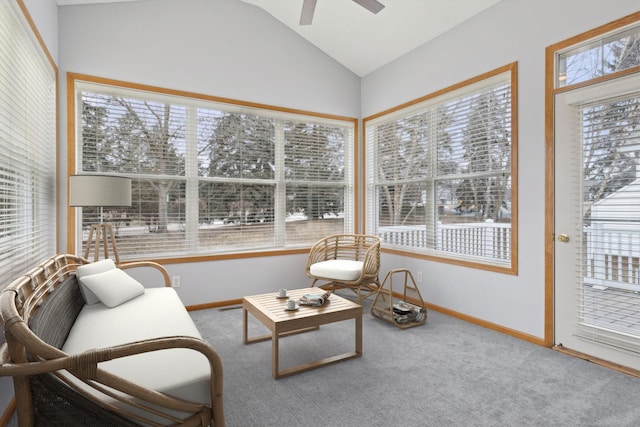 sunroom featuring a wealth of natural light, a ceiling fan, and lofted ceiling