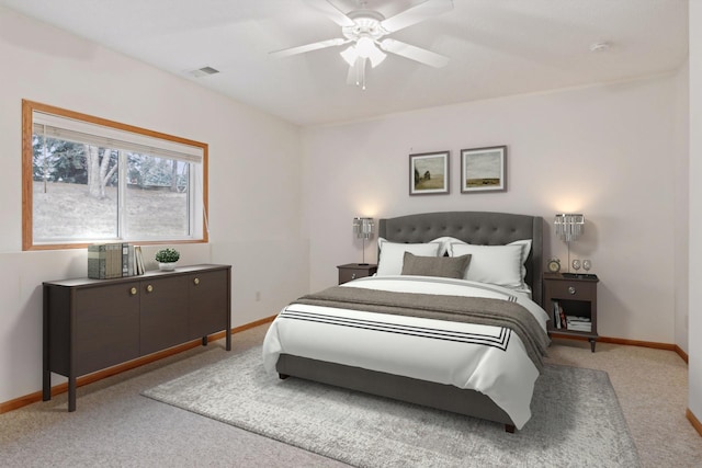 bedroom with visible vents, baseboards, carpet, and a ceiling fan