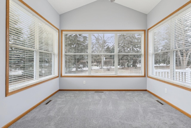 unfurnished sunroom with lofted ceiling and visible vents