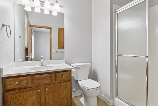 full bath featuring tile patterned floors, a shower stall, toilet, and vanity