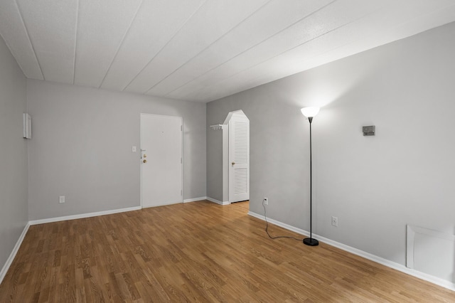 spare room with hardwood / wood-style floors