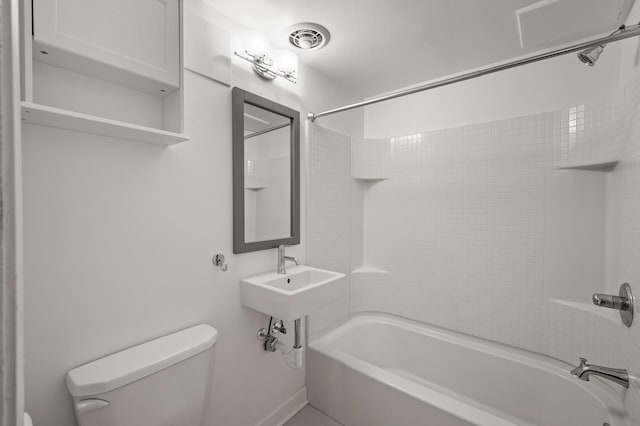 full bathroom featuring shower / bathtub combination, toilet, and sink