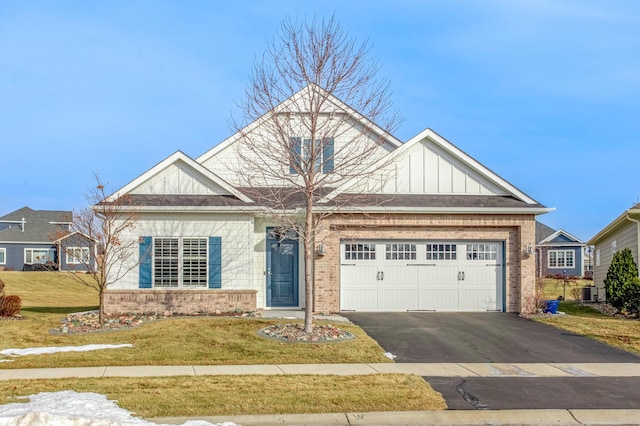 craftsman-style home featuring a garage and a front yard