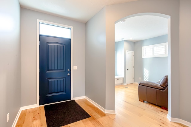 foyer entrance with light hardwood / wood-style flooring