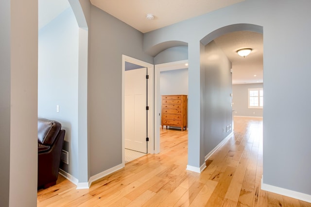 hall with light hardwood / wood-style floors